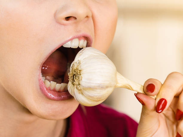 woman eating garlic